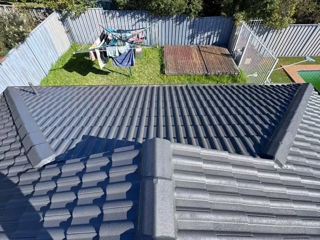 Elevated overview of a dark tiled roof