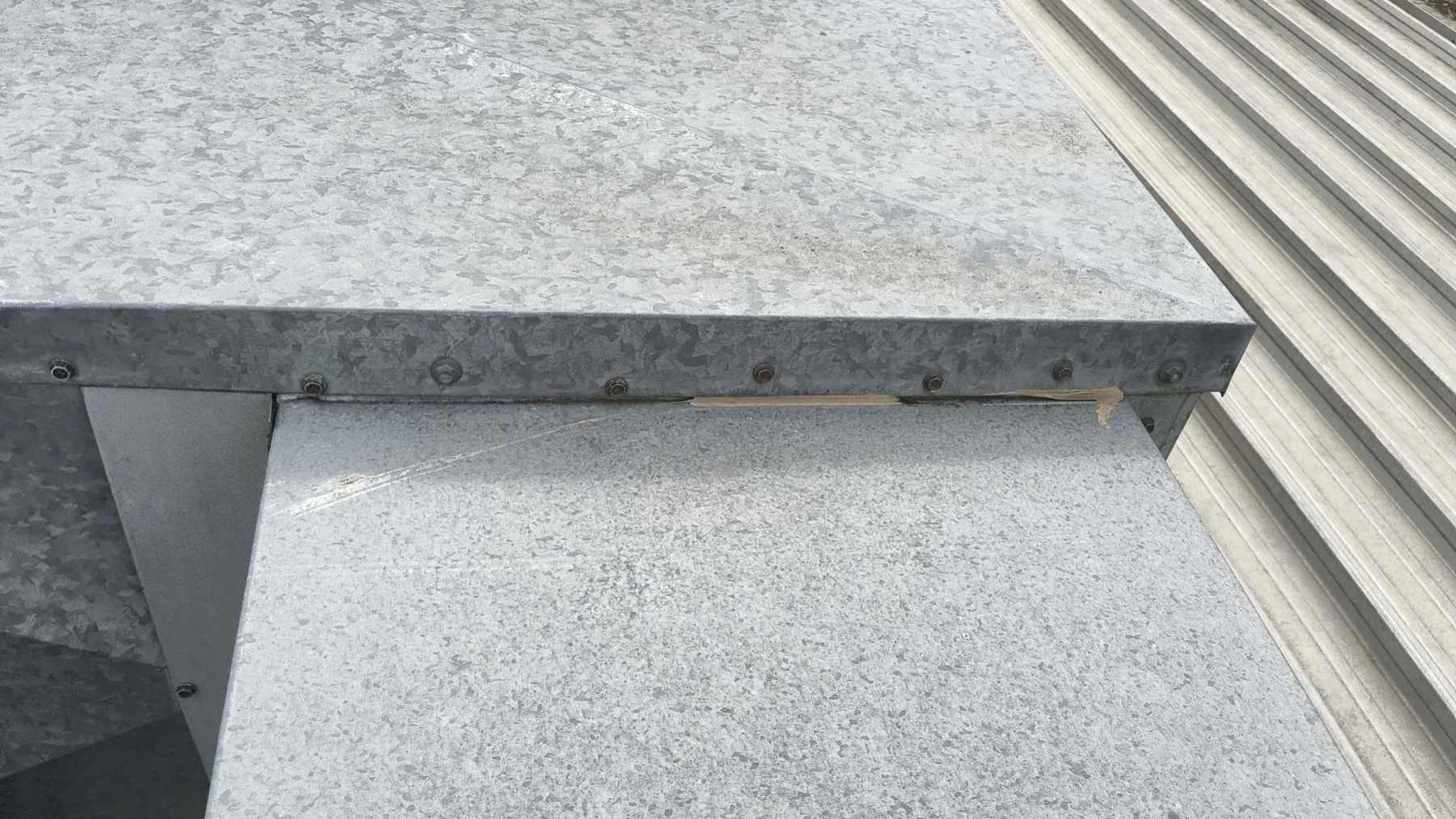 Close view inside a metal box gutter