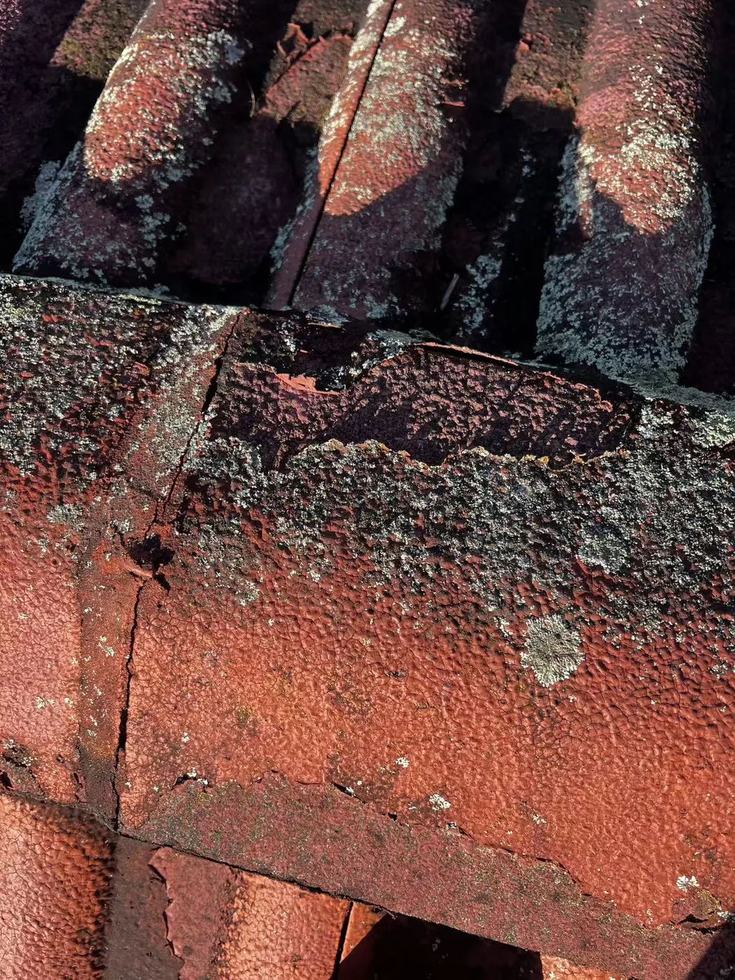 Close view of mortar below roof ridge caps