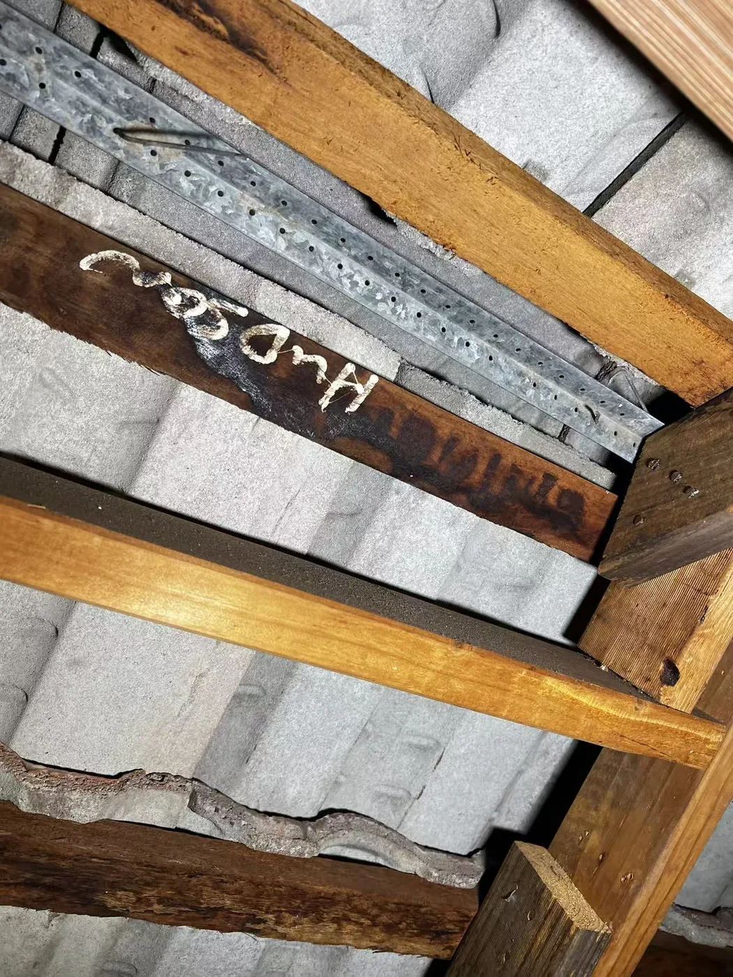 Measurement detail beside exposed roof framing