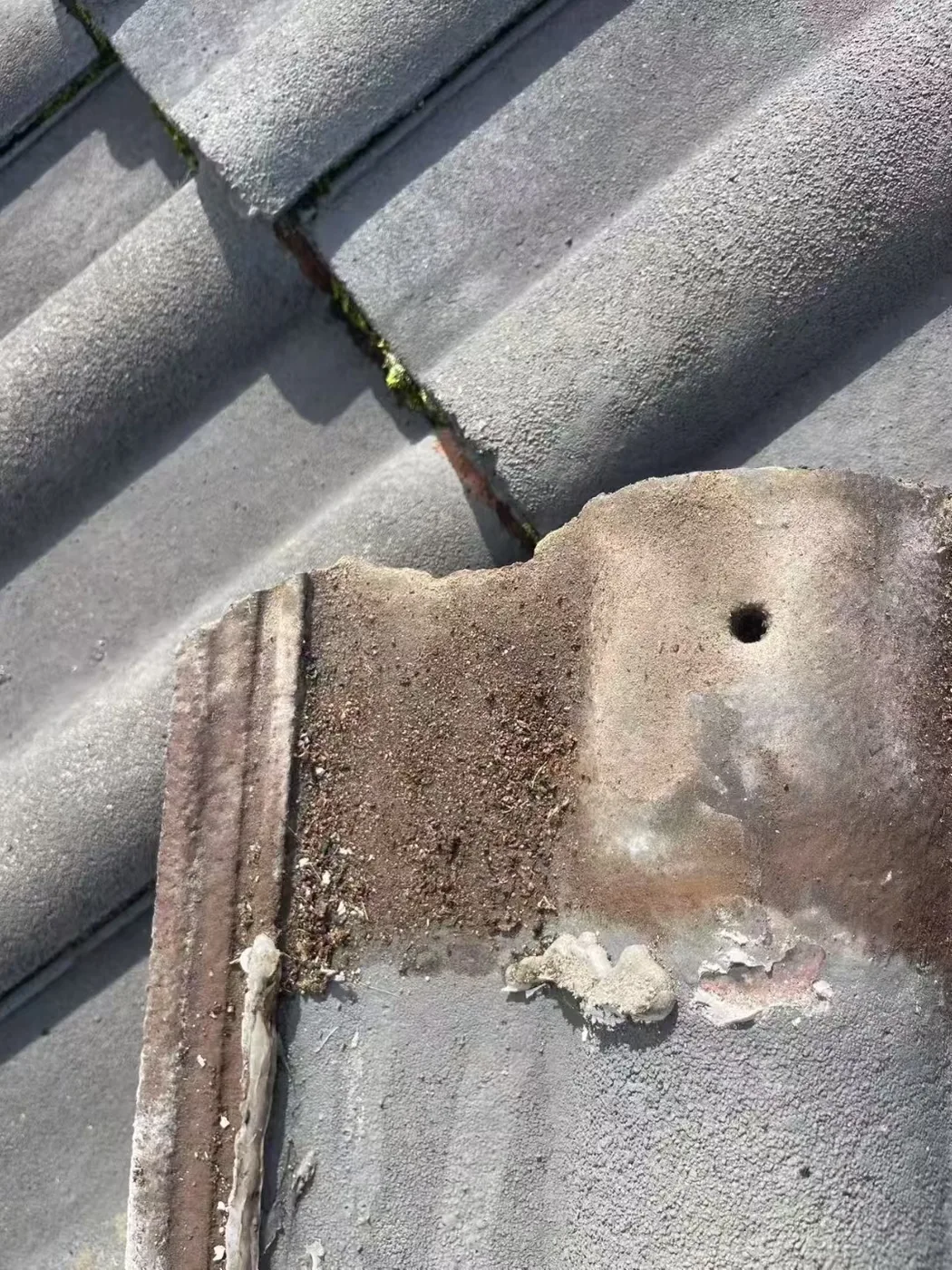 Tiled roof penetration and surrounding material