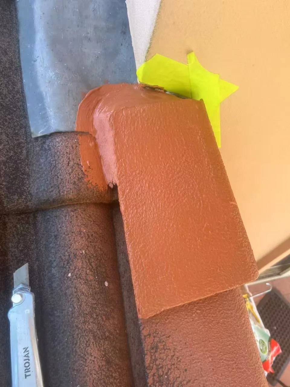 Wall-to-tile roof flashing detail