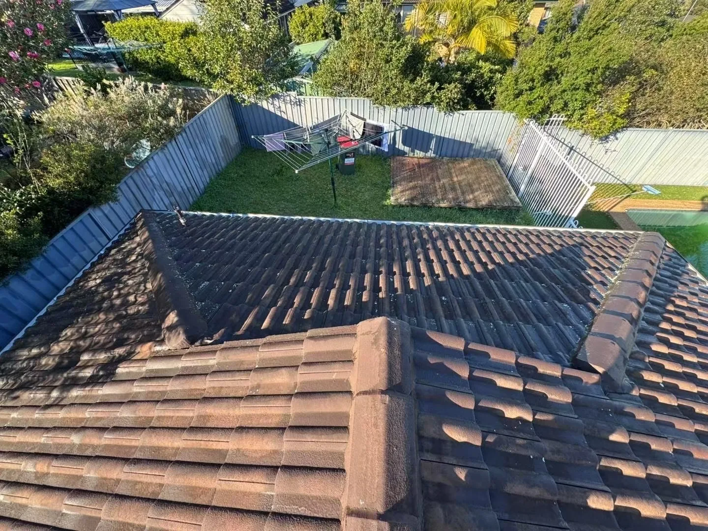 Elevated overview of a weathered tiled roof