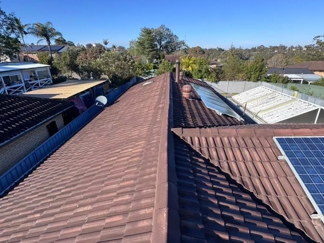 Wide view of a weathered tiled roof